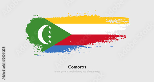 Brush painted grunge flag of Comoros. Abstract dry brush flag on isolated background