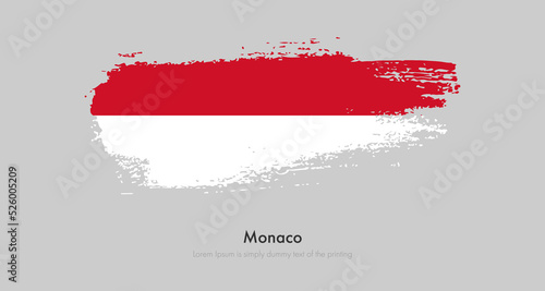 Brush painted grunge flag of Monaco. Abstract dry brush flag on isolated background