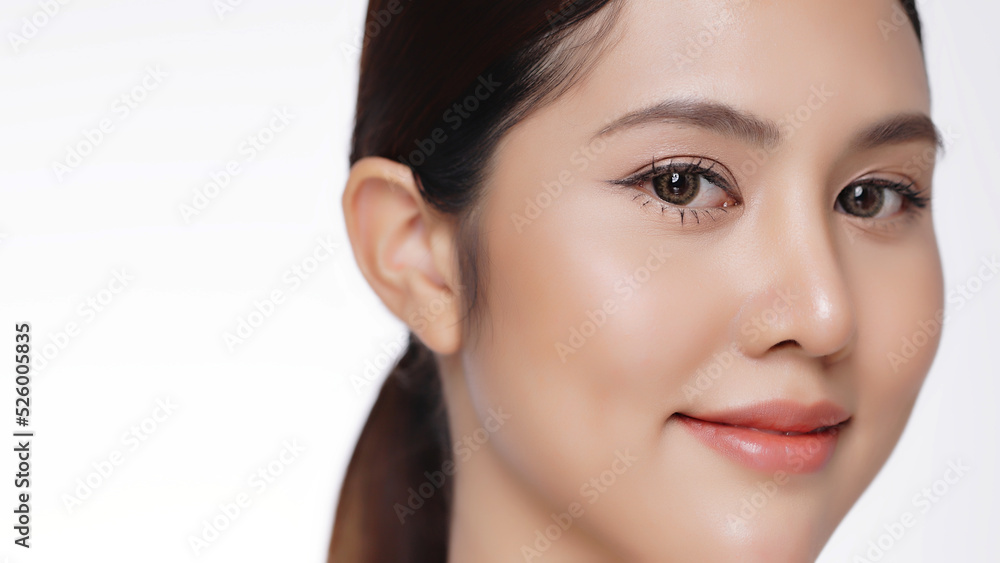 Closeup beauty young Asian woman face looking at camera, isolated on white background.
