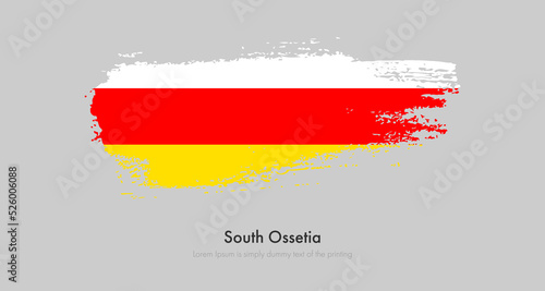 Brush painted grunge flag of South Ossetia. Abstract dry brush flag on isolated background