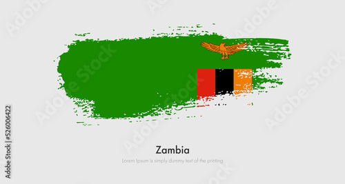 Brush painted grunge flag of Zambia. Abstract dry brush flag on isolated background photo