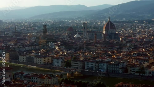 Fly Over The Architectural City Of Florence With Gothic Duomo In Tuscany Region, Central Italy. Aerial Drone Shot photo