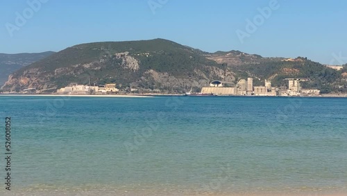 landscape with lake and shoreline with mountains in background. photo