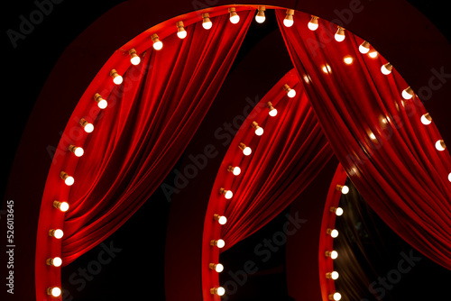 red curtain background with light bulbs