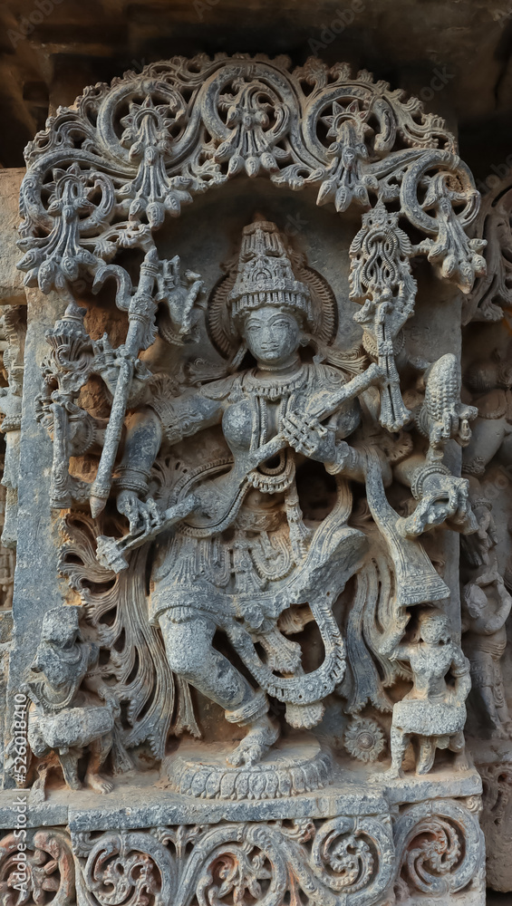 The Sculpture of Goddess Sarasvati along with Veena, Lakshminarsimha Temple, Javagal, Hassan, Karnataka, India.