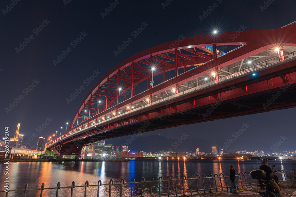 This red bridge connects the city of Kobe with Kobe airport.At night this bridge is lit up with lights.	