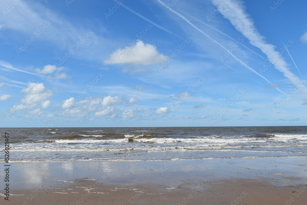 Dramatic cloudy sky over the sea with waves crashing onto the beach. Taken in Fleetwood Lancashire England. Dramatic cloudy sky over the sea with waves crashing onto the beach. Taken in Fleetwood Lancashire England.