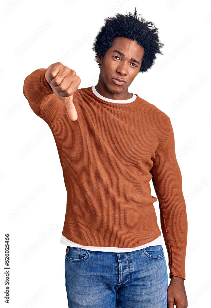 Handsome african american man with afro hair wearing casual clothes looking unhappy and angry showing rejection and negative with thumbs down gesture. bad expression. Handsome african american man with afro hair wearing casual clothes looking unhappy and angry showing rejection and negative with thumbs down gesture. bad expression.