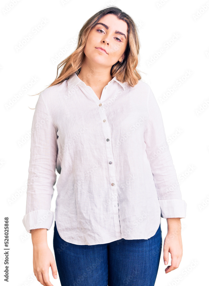 Young caucasian woman wearing casual clothes relaxed with serious expression on face. simple and natural looking at the camera. Young caucasian woman wearing casual clothes relaxed with serious expression on face. simple and natural looking at the camera.