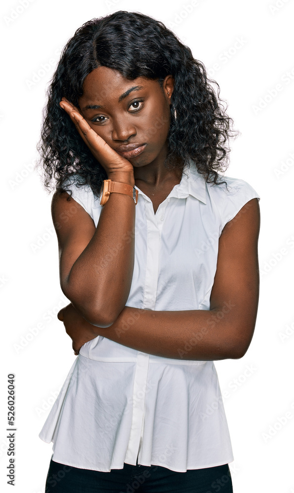 Beautiful african young woman wearing casual clothes thinking looking tired and bored with depression problems with crossed arms. Beautiful african young woman wearing casual clothes thinking looking tired and bored with depression problems with crossed arms.