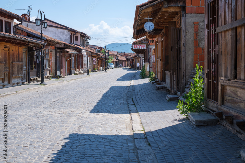 A narrow street in Gjakova Kosovo. The street is full of small shops, mostly tailors.