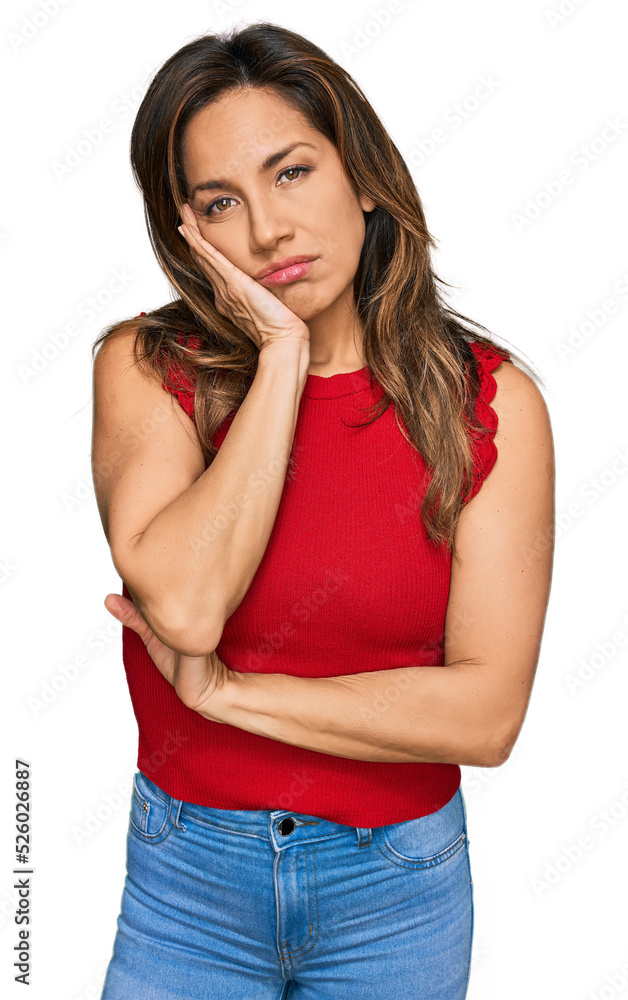 Young hispanic woman wearing casual clothes thinking looking tired and bored with depression problems with crossed arms. Young hispanic woman wearing casual clothes thinking looking tired and bored with depression problems with crossed arms.