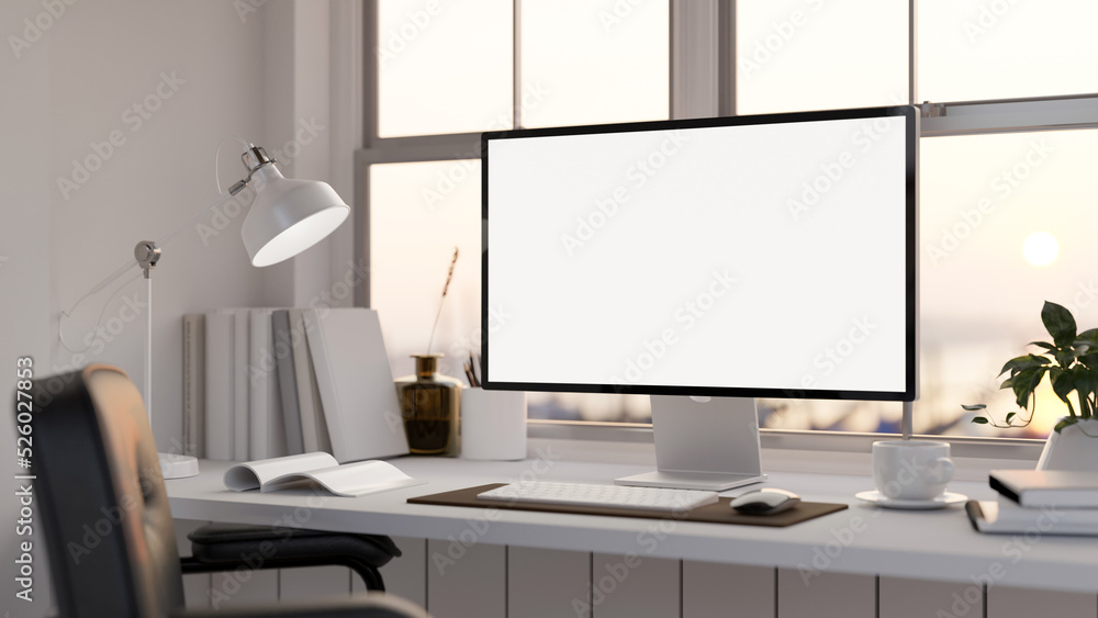 Fototapeta premium Modern office desk with computer mockup, table lamp, book and accessories over the window