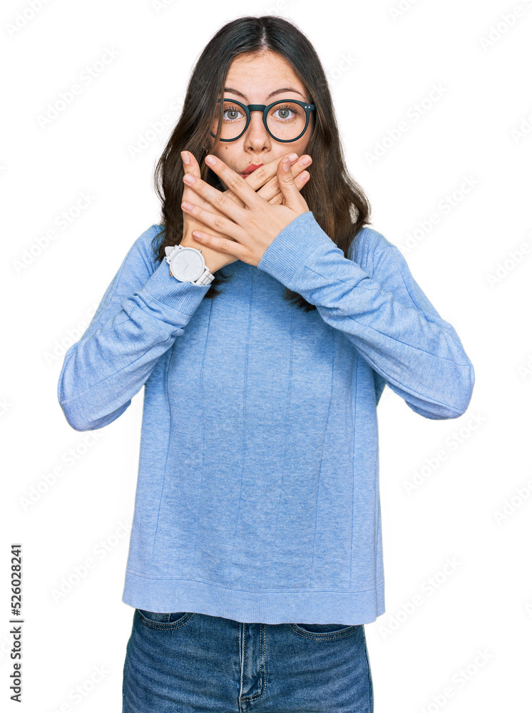 Young beautiful woman wearing casual clothes and glasses shocked covering mouth with hands for mistake. secret concept. Young beautiful woman wearing casual clothes and glasses shocked covering mouth with hands for mistake. secret concept.