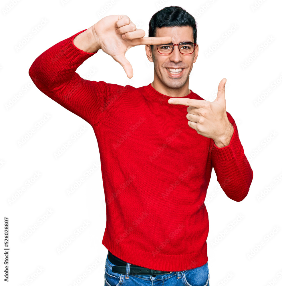 Handsome hispanic man wearing casual clothes and glasses smiling making frame with hands and fingers with happy face. creativity and photography concept. Handsome hispanic man wearing casual clothes and glasses smiling making frame with hands and fingers with happy face. creativity and photography concept.