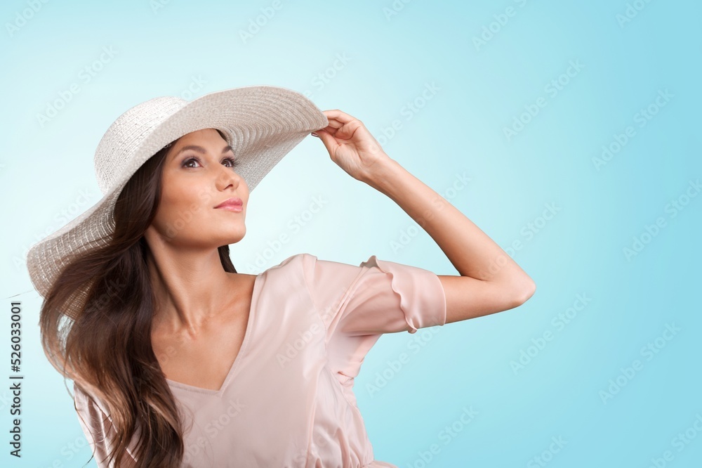Portrait of young woman in resort fashion on background Portrait of young woman in resort fashion on background