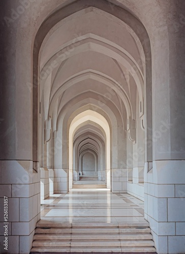 Canvas Print Vertical shot of a white building interior with archways