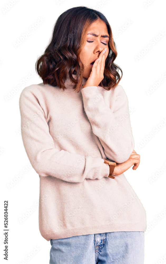 Young beautiful mixed race woman wearing winter turtleneck sweater bored yawning tired covering mouth with hand. restless and sleepiness. Young beautiful mixed race woman wearing winter turtleneck sweater bored yawning tired covering mouth with hand. restless and sleepiness.