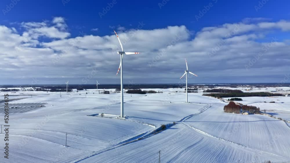 Wind turbine in snowy winter. Alternative energy in winter. Wind turbine in snowy winter. Alternative energy in winter.