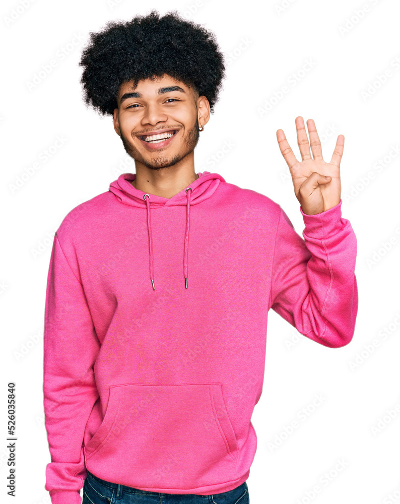 Young african american man with afro hair wearing casual pink sweatshirt showing and pointing up with fingers number four while smiling confident and happy. Young african american man with afro hair wearing casual pink sweatshirt showing and pointing up with fingers number four while smiling confident and happy.