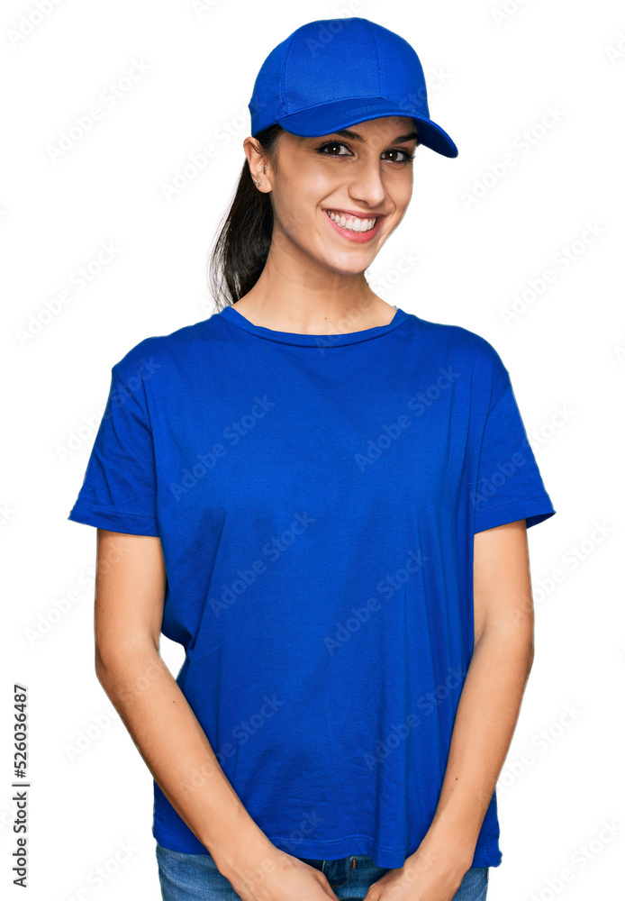 Young hispanic girl wearing delivery courier uniform with a happy and cool smile on face. lucky person. Young hispanic girl wearing delivery courier uniform with a happy and cool smile on face. lucky person.