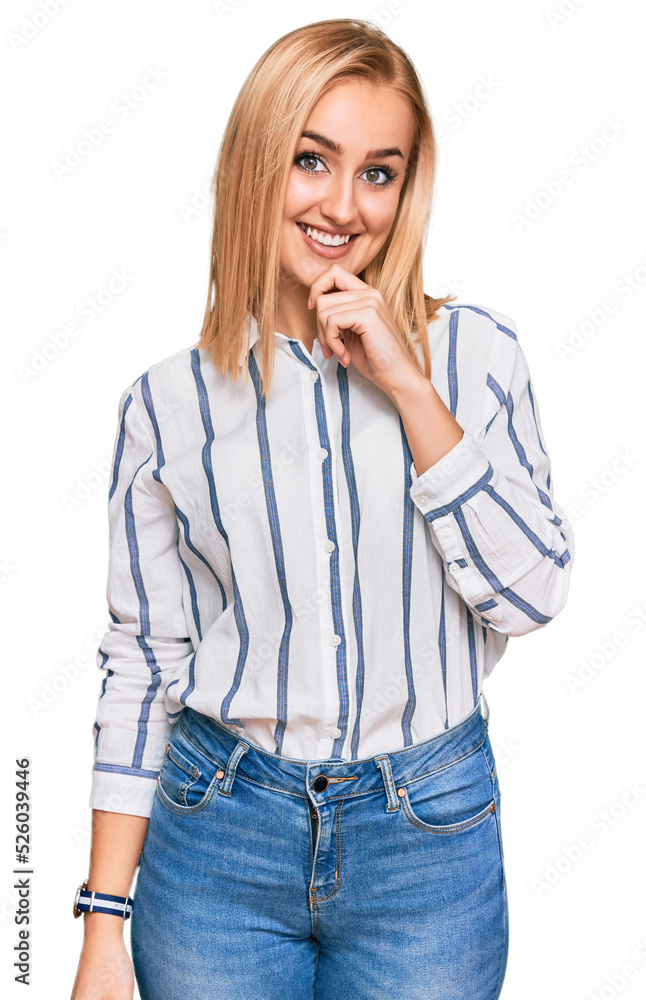 Beautiful caucasian woman wearing casual clothes looking confident at the camera smiling with crossed arms and hand raised on chin. thinking positive. Beautiful caucasian woman wearing casual clothes looking confident at the camera smiling with crossed arms and hand raised on chin. thinking positive.