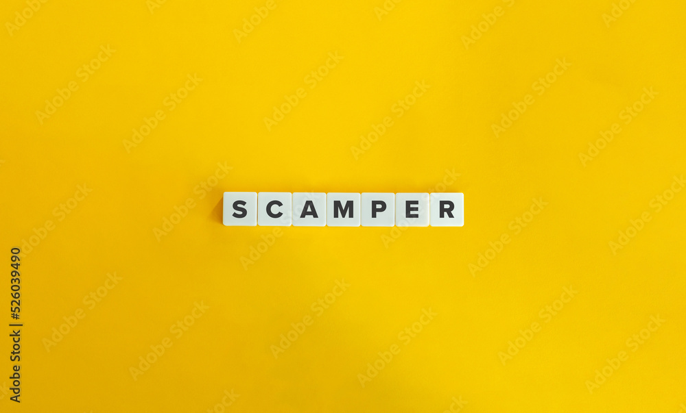 Scamper Acronym and Banner. Letter Tiles on Yellow Background. Minimal Aesthetics. Scamper Acronym and Banner. Letter Tiles on Yellow Background. Minimal Aesthetics.