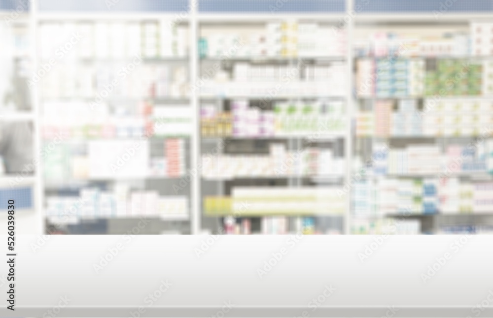 Empty white counter top with blur pharmacy drugstore shelves background