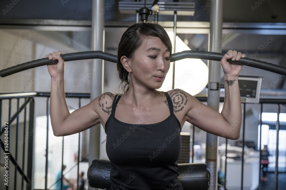 woman exercising with dumbbells