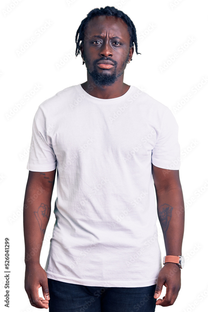 Young african american man with braids wearing casual white tshirt depressed and worry for distress, crying angry and afraid. sad expression. Young african american man with braids wearing casual white tshirt depressed and worry for distress, crying angry and afraid. sad expression.