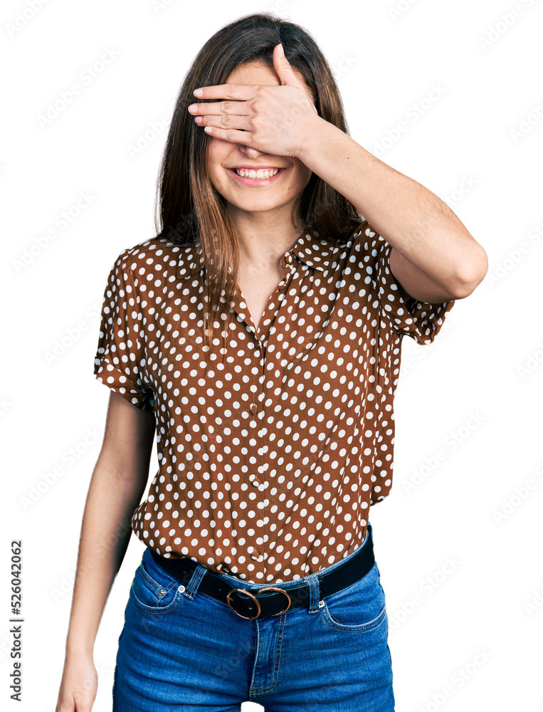 Young caucasian girl wearing casual clothes smiling and laughing with hand on face covering eyes for surprise. blind concept. Young caucasian girl wearing casual clothes smiling and laughing with hand on face covering eyes for surprise. blind concept.