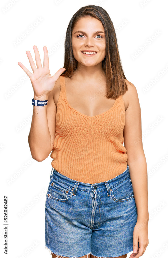 Young caucasian woman wearing casual clothes showing and pointing up with fingers number five while smiling confident and happy. Young caucasian woman wearing casual clothes showing and pointing up with fingers number five while smiling confident and happy.