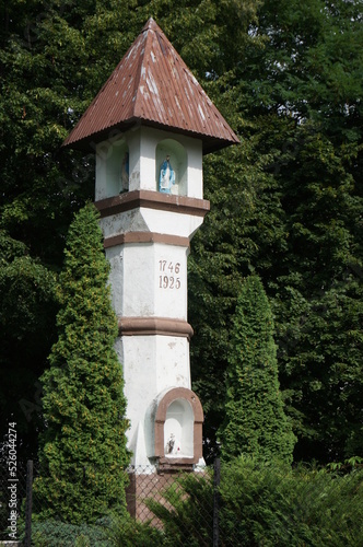 Historic wayside shrine in Klimontow district, religious depiction by road. Sosnowiec, Poland.
