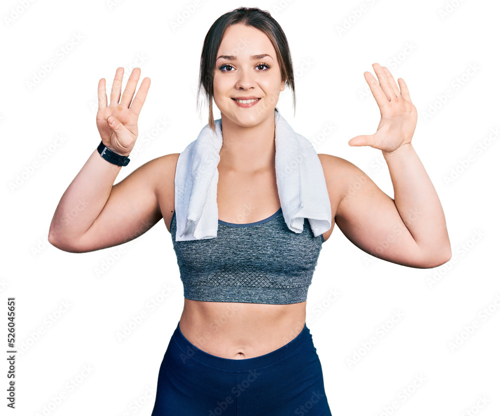 Young hispanic girl wearing sportswear and towel showing and pointing up with fingers number nine while smiling confident and happy. Young hispanic girl wearing sportswear and towel showing and pointing up with fingers number nine while smiling confident and happy.
