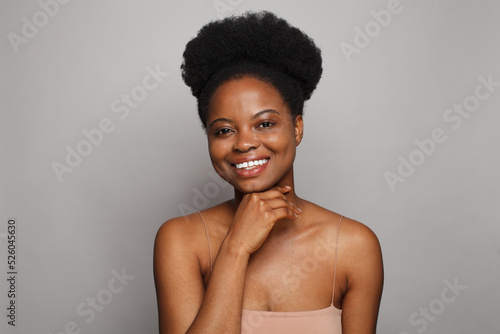  Attractive black woman with cute smile and healthy clean skin portrait