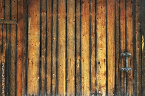Wooden wall under a blue sky in summer photo