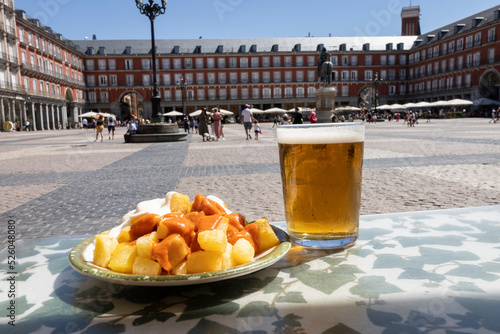 Aioli and bravas potatoes in Plaza Mayor in Madrid, Spain. Typical Spanish tapas photo