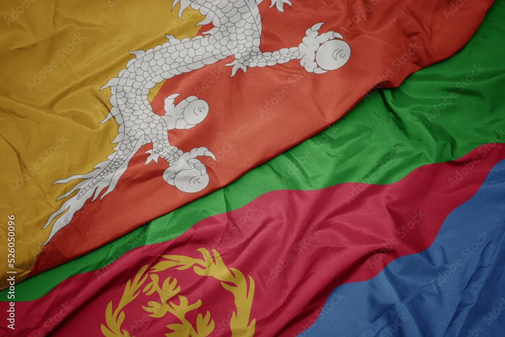 waving colorful flag of eritrea and national flag of bhutan. waving colorful flag of eritrea and national flag of bhutan.