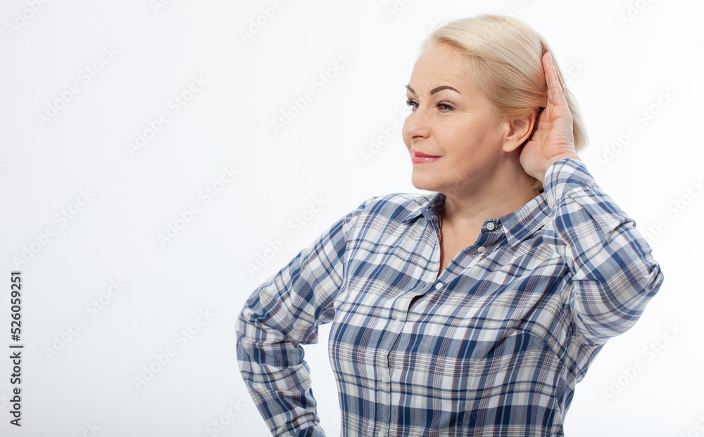 Nosy woman hand to ear gesture trying carefully intently secretly listen in on juicy gossip conversation news isolated white background. Human face expression. Hard to hear Nosy woman hand to ear gesture trying carefully intently secretly listen in on juicy gossip conversation news isolated white background. Human face expression. Hard to hear