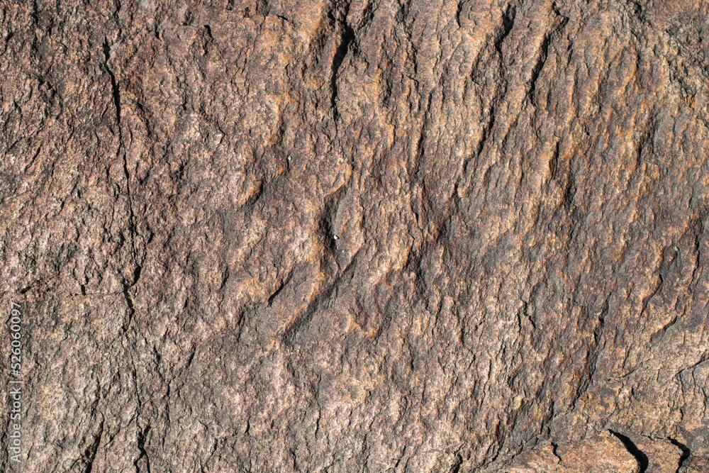 Raw granite rock texture background. Fragment of natural stone wall. Raw granite rock texture background. Fragment of natural stone wall.