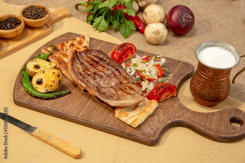 Delicious Turkish Traditional Kebab cutlet with grilled tomato on white plate stock photo
Above, Angle, Animal, Barbecue - Meal, Beef
