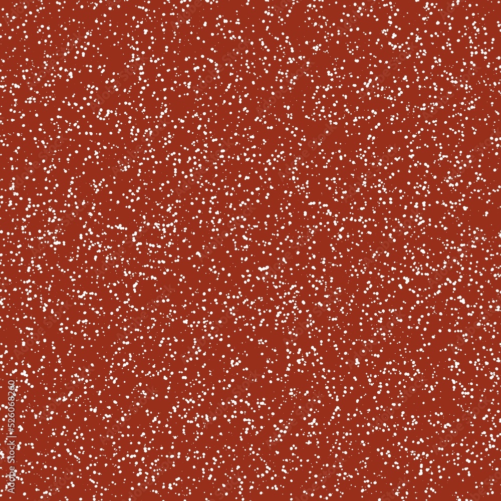 White speckled paper on a brown surface. White speckled paper on a brown surface.