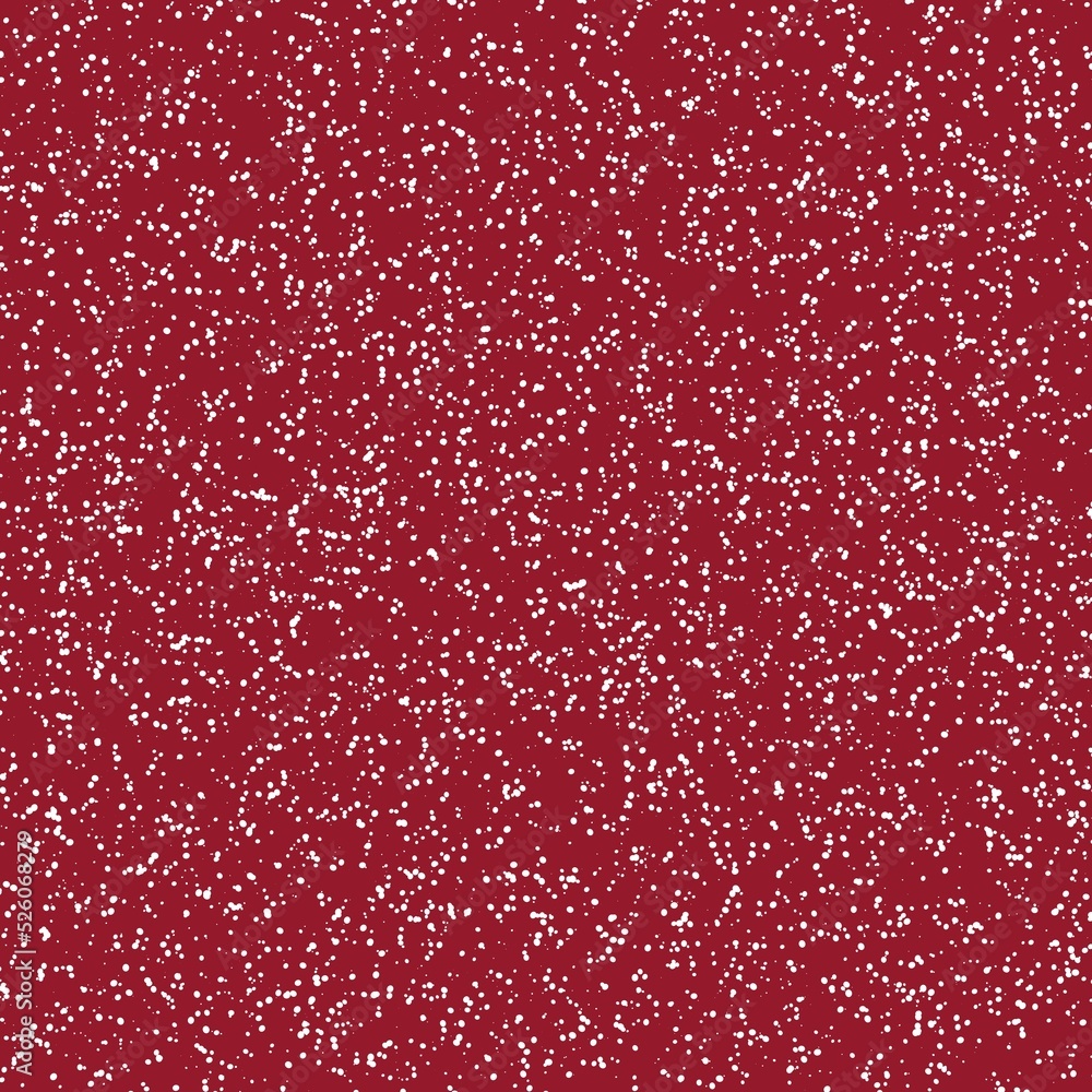 White speckled paper on a dark red surface.