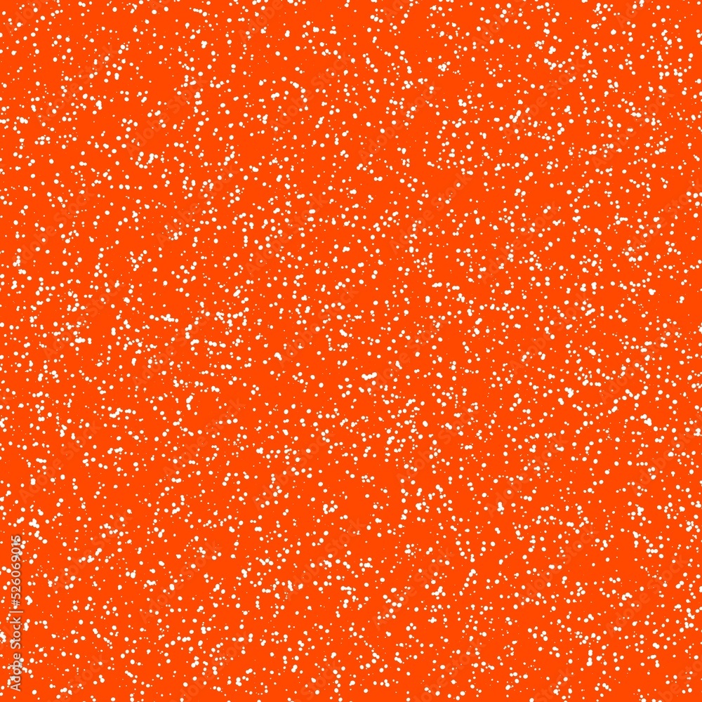 White speckled paper on vivid orange surface White speckled paper on vivid orange surface