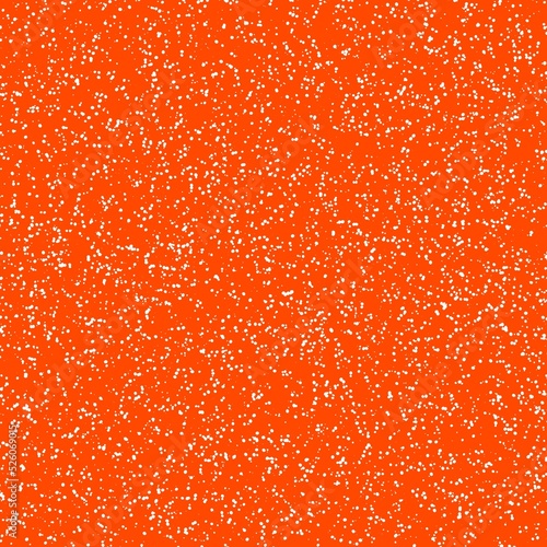 White speckled paper on vivid orange surface