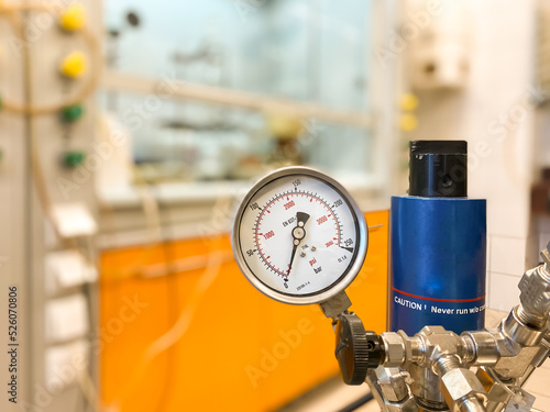 A pressure regulator in a chemical synthesis laboratory.