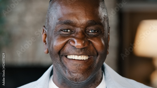 Εκτύπωση καμβά Happy emotional african american adult man sincere smiling laughing loud indoors