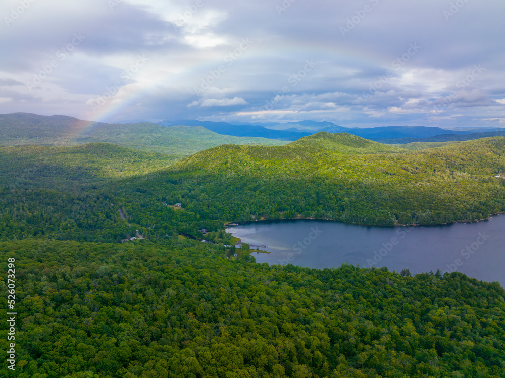Aerial view of Rainbow over Stinson Lake in White Mountain National Forest in summer in town of Rumney, Grafton County, New Hampshire NH, USA. 