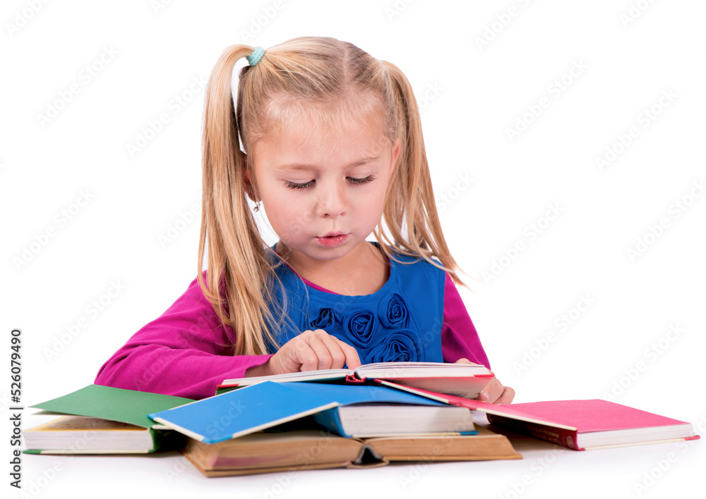 Little smart girl holding a book and reading it, on a white background Little smart girl holding a book and reading it, on a white background