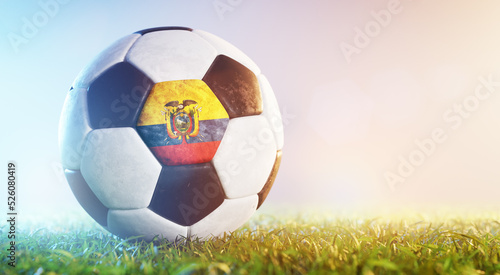 Football soccer ball with flag of Columbia on grass